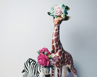 Schleich baby giraffe, wearing floral crown, mini personalized flag, cake topper animal.