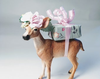 Schleich deer cake topper, wearing a floral crown, with mini personalized flag, add extra accessories, cake decoration.