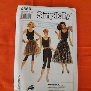 May include: Simplicity sewing pattern number 9559 for sizes 6-12. The pattern includes instructions for making two different outfits: a black top with a black and white polka dot skirt and a black top with black leggings. The pattern is suitable for use with an overlock or serger machine.