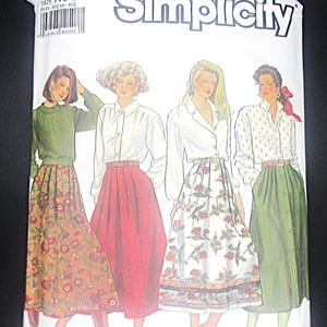 May include: Simplicity sewing pattern featuring illustrations of women in various outfits, including skirts and blouses. The pattern number is 9876, size N5 (10-18). The package has a white background with the Simplicity logo.