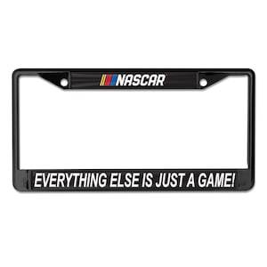 May include: Black metal license plate frame with the NASCAR logo and the text "EVERYTHING ELSE IS JUST A GAME!"