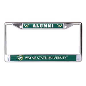 May include: Chrome license plate frame with a green and gold Wayne State University logo and the text "W ALUMNI W" on the top.