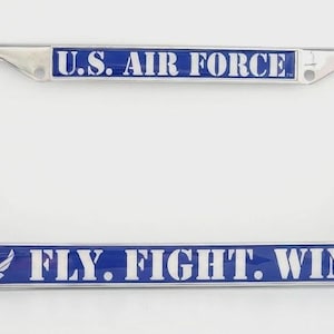 May include: A chrome license plate frame with blue accents. The top bar reads "U.S. AIR FORCE" in white letters. The bottom bar displays "FLY. FIGHT. WIN." with the Air Force symbol. A patriotic accessory.