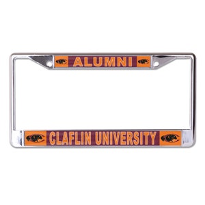 May include: Chrome license plate frame with a maroon and orange design. The frame features the text "Alumni" and "Claflin University" with a panther logo.
