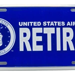 United States Air Force Retired in Silver on Blue Embossed License Plate Officially Licensed Product