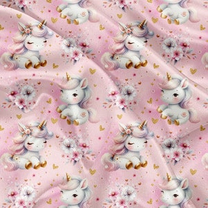 May include: A pink fabric with a repeating pattern of white unicorns with gold horns and hooves. Each unicorn is surrounded by pink and white flowers and gold glitter.