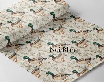 May include: A roll of fabric featuring a repeating pattern of mallard ducks and floral elements in shades of brown, green, and beige. The fabric has a vintage aesthetic, with the text "NoirBlanc" visible.
