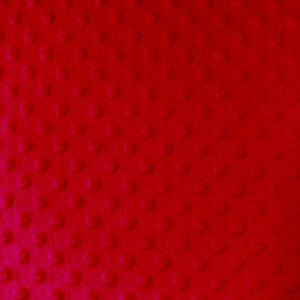 May include: Red fabric with a textured pattern of small raised circles.