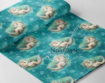 May include: A roll of fabric featuring a repeating pattern of cartoon otters floating in a teal blue water background with bubbles. The otters are light brown with white bellies and are smiling. The fabric has the text "NoirBlanc" in black.