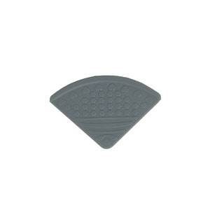 May include: A gray silicone corner guard with a textured surface and a heart pattern. The corner guard is designed to protect children from sharp corners.
