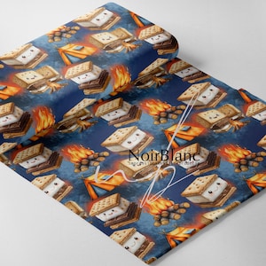 May include: A fabric with a repeating pattern of smiling s'mores, campfires, and tents on a dark blue background. The s'mores are made of graham crackers, marshmallows, and chocolate. The fabric has the text "NoirBlanc Impressions textilebroderie".