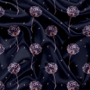 May include: A dark blue fabric with a repeating pattern of white dandelion flowers. The fabric has a silky texture and is draped in soft folds.