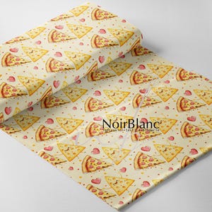 May include: A roll of fabric with a repeating pattern of smiling pizza slices and small red hearts on a cream background. The fabric has the text "NoirBlanc Impression textile broderie".