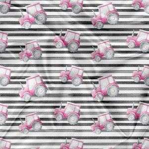 May include: A seamless pattern featuring pink toy tractors on a white background with black stripes. The tractors have gray wheels and are arranged in a repeating pattern.