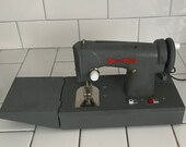 Child size SewEtte Gray with red sewing machine hand crank Battery operated with foot pedal Japan Metal 1930 39 s collectible display