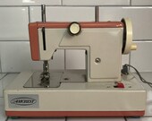 Child size Amcrest Ivory with Dark Peach sewing machine hand crank Battery operated Japan Metal 1940 39 s collectible display