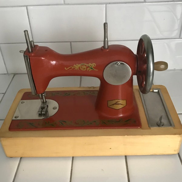 Child size USSR sewing machine Dark Orange Lots of Gold scroll work All metal original 1930's hand crank