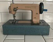 Child size SewEtte Blue and Beige sewing machine hand crank Battery operated Japan Metal 1940 39 s collectible display all metal