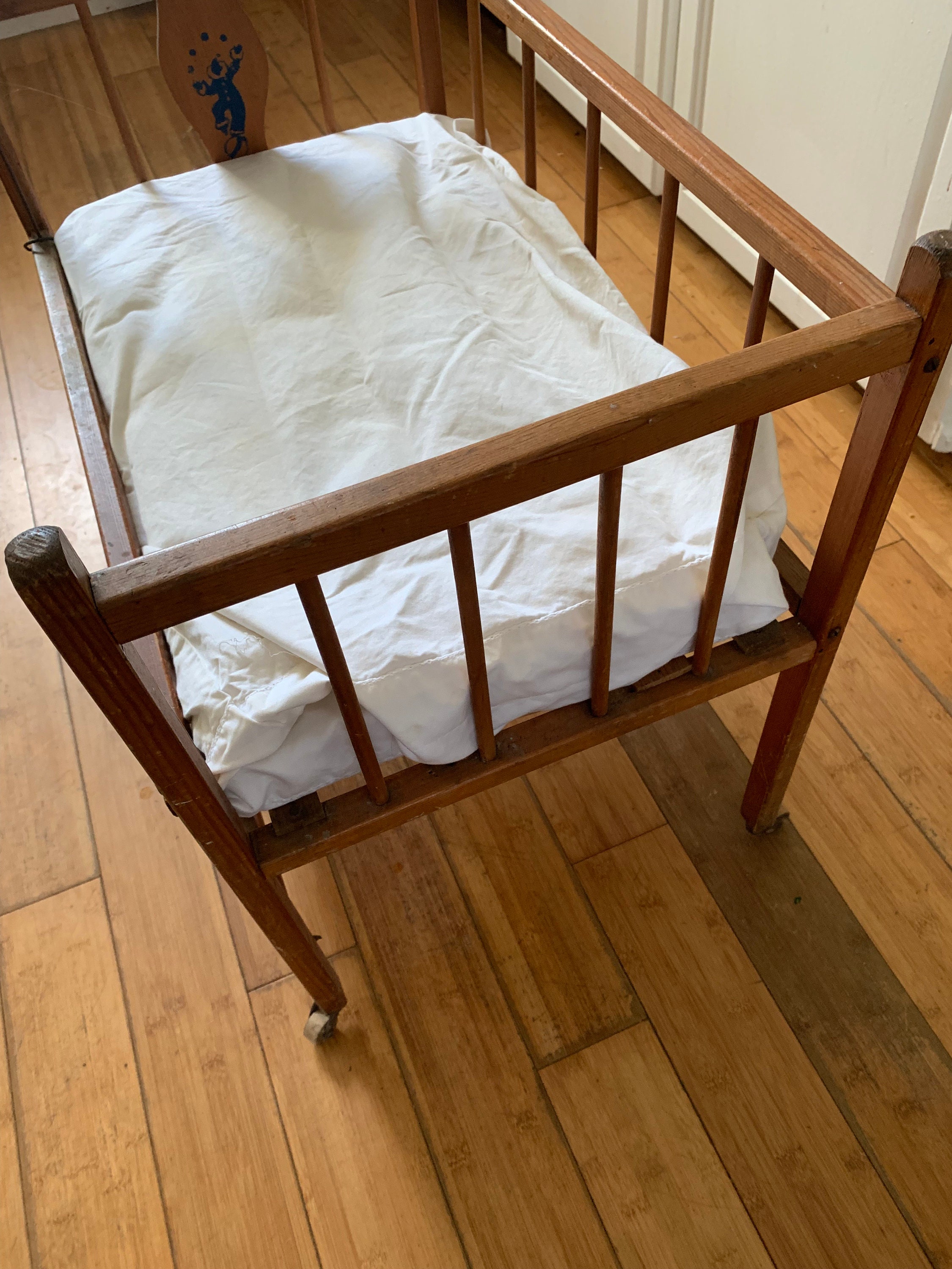 Antique baby doll on sale crib on wheels