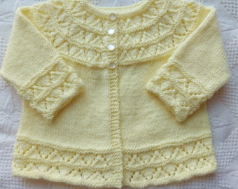 Classic baby sweater newly hand knitted by me in size 3-6 months.This sweater is  available in purple,blue,yellow,pink,antique white