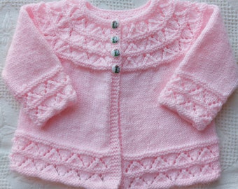 Classic baby sweater newly hand knitted by me in size 3-6 months.This sweater is  available in purple,blue,yellow,pink,antique white