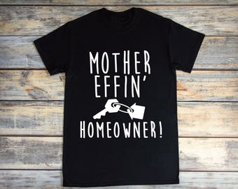 May include: Black t-shirt with white text that reads "Mother Effin' Homeowner!" and a graphic of a key and a house key.