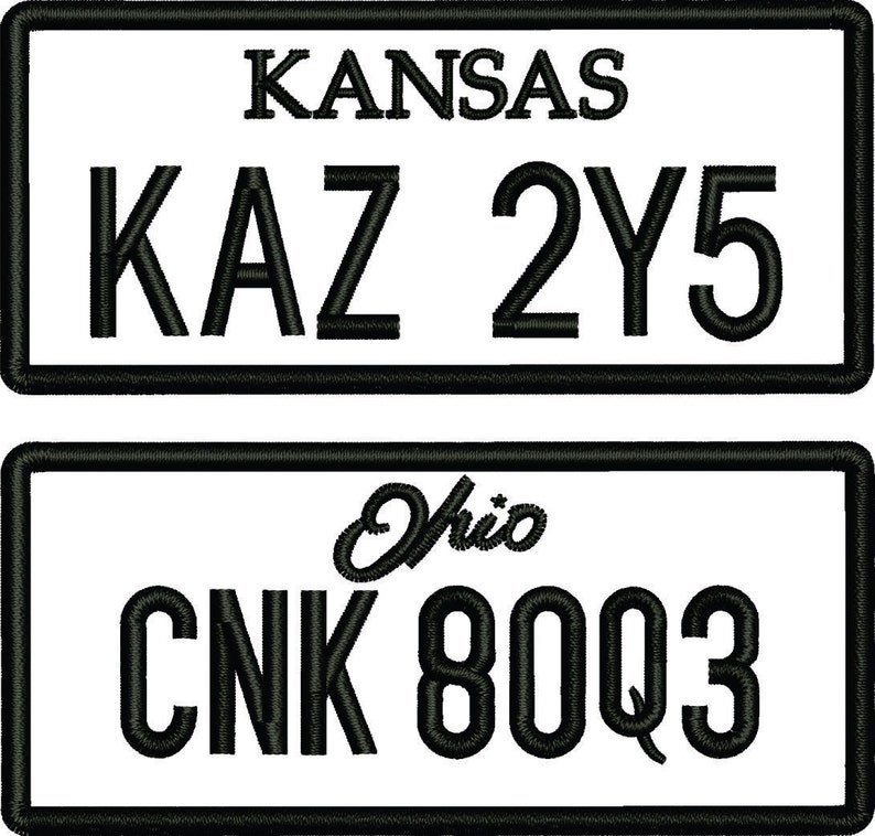 May include: Two black and white number plates. The top plate reads "KANSAS" and "KAZ 2Y5". The bottom plate reads "Ohio" and "CNK 80Q3".