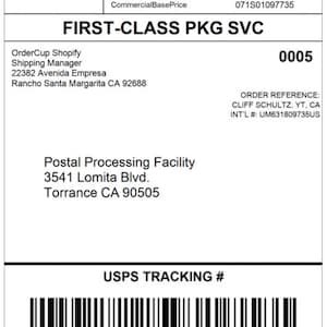 May include: A white USPS First-Class Package Service label with black text. The label includes the sender's address, the recipient's name and address, the order reference, and the tracking number. The label also includes a barcode.