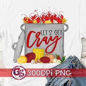 May include: A white t-shirt with a design of a pot of crawfish with the text "Let's Get Cray".