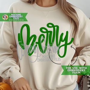 May include: A cream-coloured sweatshirt featuring the word "Merry" embroidered in bright green cursive script. The design includes text that reads "Machine Embroidery Files" and "For Use With Embroidery Foam".