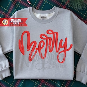 Peut inclure: Un sweat-shirt gris clair avec le mot "Berry" en écriture rouge sur le devant. Le sweat-shirt a un col rond et des manches longues. La marque "Gildan" est visible sur l'étiquette. Les mots "Machine Embroidery Files" sont également visibles.