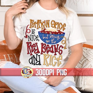 May include: White t-shirt with the text "Pumpkin Spice is Nice, but bring on the Red Beans and Rice" in colorful letters. A bowl of red beans and rice is pictured above the text. The text "300DPI PNG" is at the bottom of the shirt.