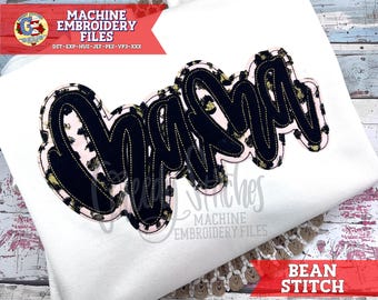 May include: White sweatshirt with a large "Mama" design. The design features black lettering with a leopard print pattern and gold stitching. The words "Machine Embroidery Files" and "Bean Stitch" are also visible.