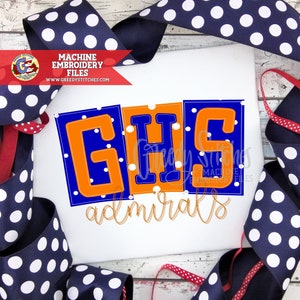 May include: Machine embroidery design featuring the letters GHS in orange and blue with white polka dots, and the word "admirals" in orange and blue.