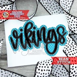 May include: A white background with the word "Vikings" in a black, cursive font with a light blue polka dot fill. The text is outlined in black. The words "Machine Embroidery Files" and "Bean Stitch" are also visible.