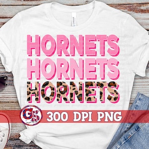 May include: White t-shirt with the words "Hornets" repeated three times in pink and black with a leopard print design. The text "300 DPI PNG" is also included on the shirt.