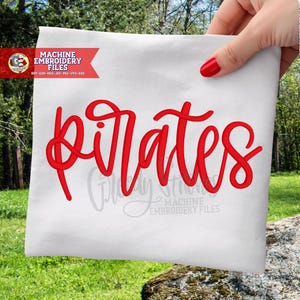 May include: A white fabric with the word "Pirates" in red cursive script. The fabric is held by a hand with red nail polish. The image also includes the text "Machine Embroidery Files" and other text.