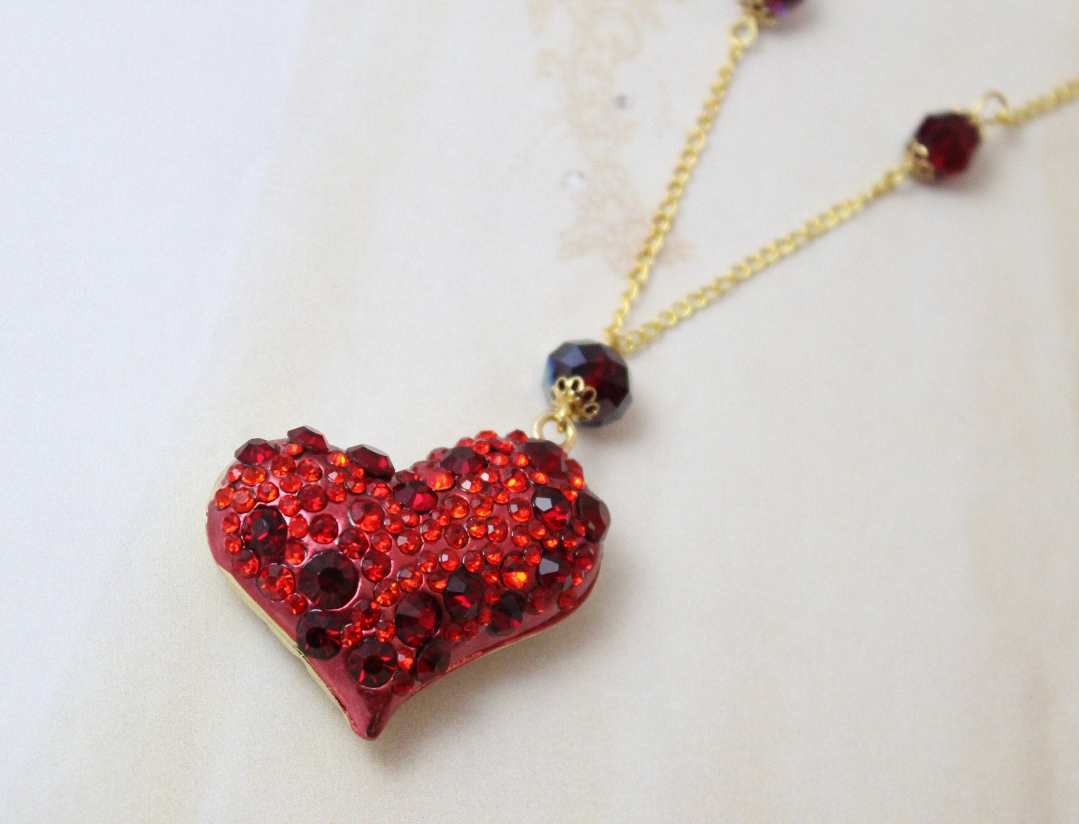 Gold red heart necklace deals