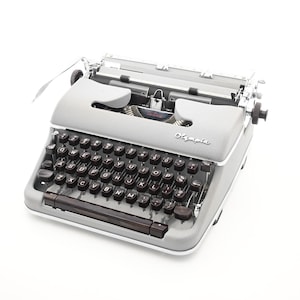 Cursive Script Olympia SM4 Typewriter with rare leather case - New platen serviced by Mr and Mrs Vintage typewriters