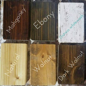 May include: Six wood samples stained in different colours: mahogany, ebony, distressed whitewash, natural, walnut, and dark walnut.