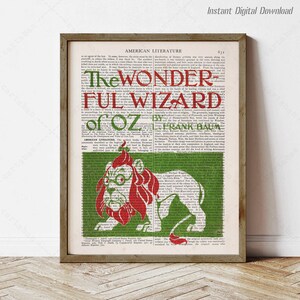 May include: A vintage book cover illustration featuring a red lion with a green background. The title "The Wonderful Wizard of Oz" is printed in red and black letters. The book is by L. Frank Baum.