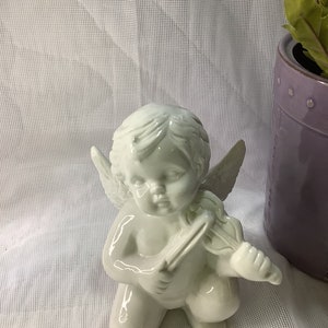 Winged Cherub Angel playing violin