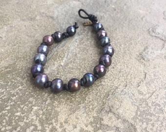 Tahitian black pearl bracelet on black leather