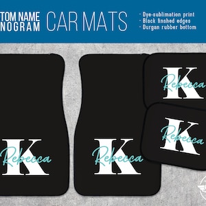 May include: Black car floor mats with a white letter K and the name Rebecca in a light blue font. The mats are made with a dye-sublimation print, black finished edges, and a Durgan rubber bottom.