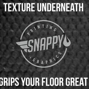 May include: A black and white logo for "Snappy Printing Graphics" with a textured background. The logo features a circle with the text "Snappy" inside and a wing and a water drop on either side. The text "Texture underneath grips your floor great" is above the logo.