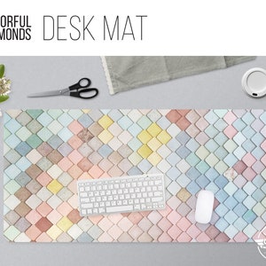 May include: A colorful desk mat with a geometric pattern of pastel diamonds. The mat is made of a durable material and is perfect for protecting your desk from scratches and spills.