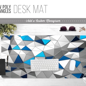 May include: A desk mat with a geometric pattern of blue, gray, and white triangles. The text "LOW POLY TRIANGLES DESK MAT" is at the top of the image. The text "Add a Custom Monogram" is below the title.