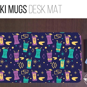 May include: A blue desk mat with a repeating pattern of tiki mugs with yellow, purple, and green accents. The text "TIKI MUGS DESK MAT" is at the top of the mat.