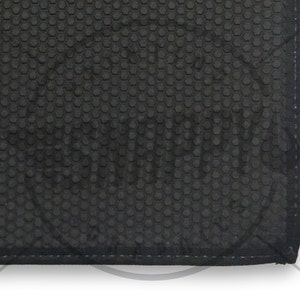 May include: Black rubber mat with a hexagonal pattern. The mat has a stitched edge.