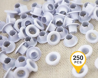 May include: A collection of small white metal eyelets for fabric projects. Each eyelet features a circular rim and a short, hollow cylindrical shaft. A yellow graphic overlay in the bottom right corner displays the text 250 PCS in black.